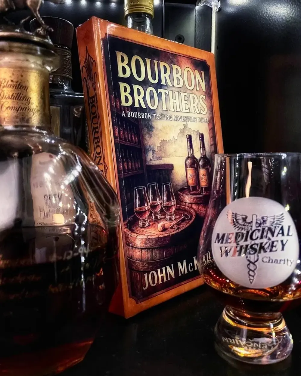 Bourbon Brothers, the novel, on the shelf beside the pour